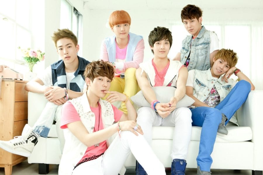 A photo of the 6 boys, all wearing bright and colourful outfits