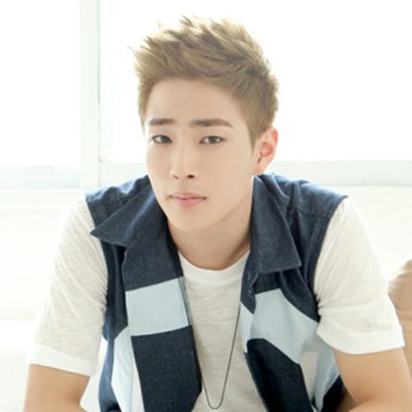 Go Up has tufted-up light brown hair. He wears a dark grey vest (with a blue-white stripe across) over a white t-shirt
